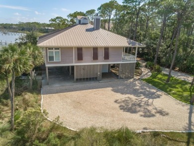 PRICE REDUCED!  Custom Built, BAY FRONT home with private dock