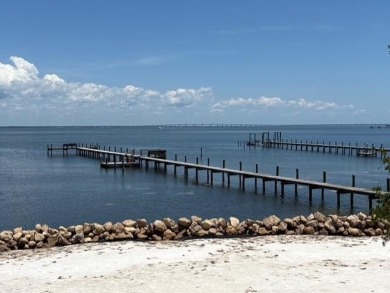 PRICE REDUCED!  Custom Built, BAY FRONT home with private dock