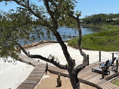 PRICE REDUCED!  Custom Built, BAY FRONT home with private dock