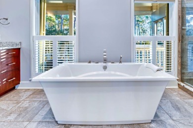 PRICE REDUCED!  Custom Built, BAY FRONT home with private dock