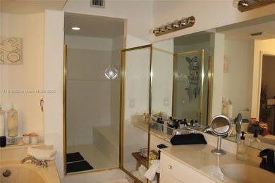 Resort-style corner unit with stunning lake views in the heart