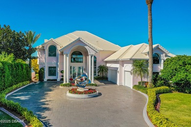 Nestled along the scenic Halifax River corridor this Ormond