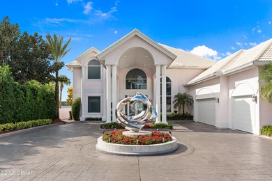 Nestled along the scenic Halifax River corridor this Ormond