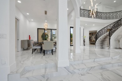 Experience breathtaking long lake views from this grand estate