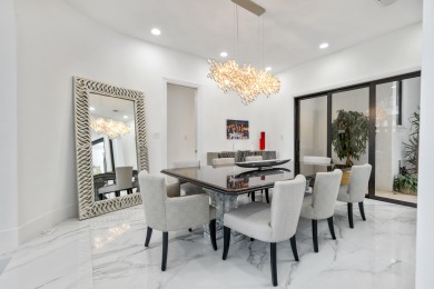 Experience breathtaking long lake views from this grand estate