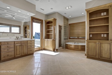 This is a beautifully maintained four-bedroom, five-bathroom