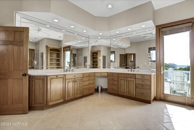 This is a beautifully maintained four-bedroom, five-bathroom