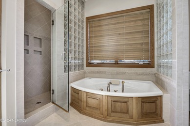 This is a beautifully maintained four-bedroom, five-bathroom