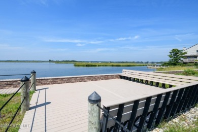 Nestled in a premier waterfront community, this exquisite