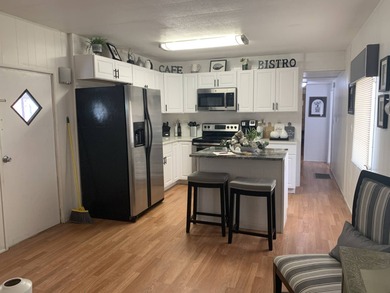 HOLIDAY SPECIAL is this PRISTINE 2-Bedroom, 1-Bathroom FULLY