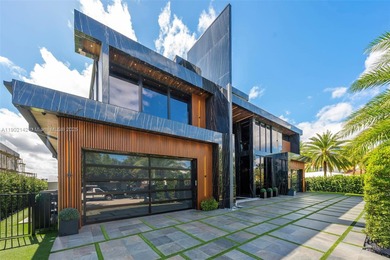 Welcome to 733 Middle River Drive in the gated community of