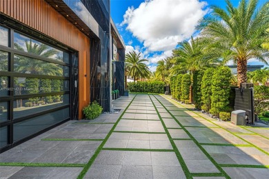 Welcome to 733 Middle River Drive in the gated community of