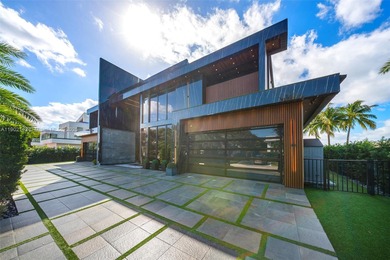 Welcome to 733 Middle River Drive in the gated community of