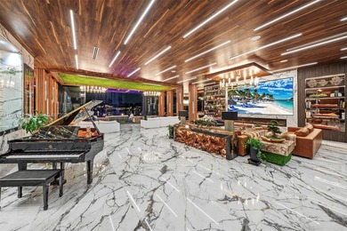 Welcome to 733 Middle River Drive in the gated community of