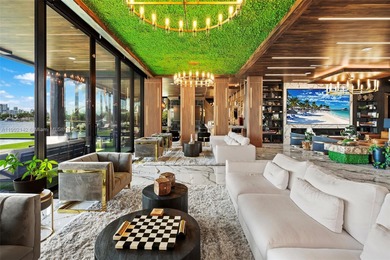 Welcome to 733 Middle River Drive in the gated community of