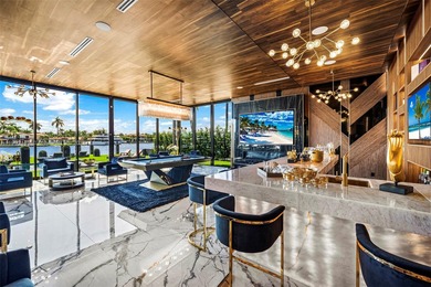 Welcome to 733 Middle River Drive in the gated community of