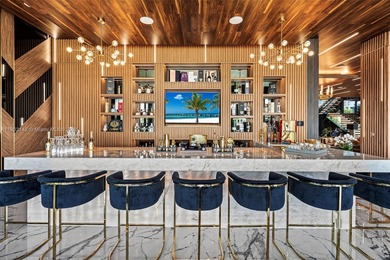 Welcome to 733 Middle River Drive in the gated community of