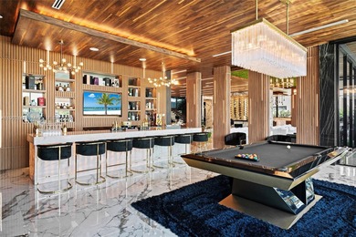 Welcome to 733 Middle River Drive in the gated community of