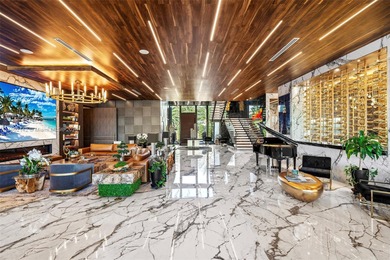 Welcome to 733 Middle River Drive in the gated community of