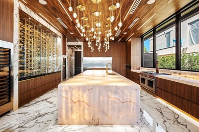 Welcome to 733 Middle River Drive in the gated community of