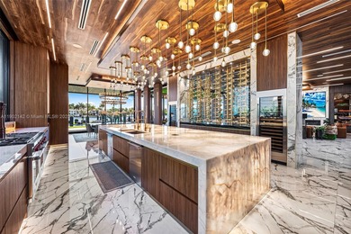 Welcome to 733 Middle River Drive in the gated community of