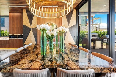 Welcome to 733 Middle River Drive in the gated community of