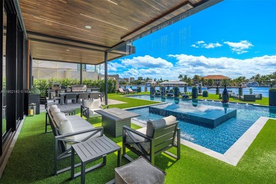 Welcome to 733 Middle River Drive in the gated community of