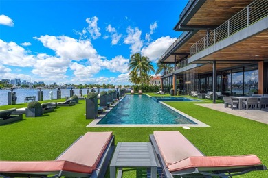 Welcome to 733 Middle River Drive in the gated community of