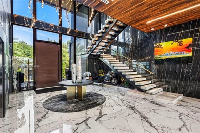 Welcome to 733 Middle River Drive in the gated community of