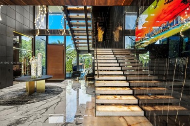 Welcome to 733 Middle River Drive in the gated community of