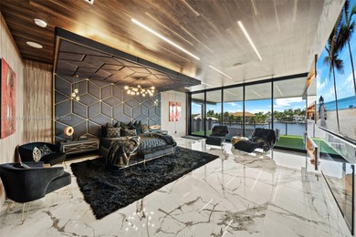 Welcome to 733 Middle River Drive in the gated community of