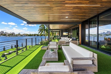 Welcome to 733 Middle River Drive in the gated community of