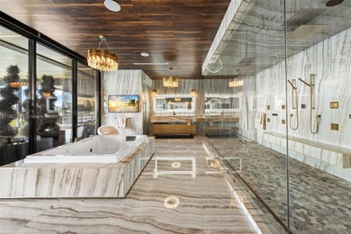 Welcome to 733 Middle River Drive in the gated community of