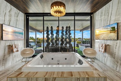 Welcome to 733 Middle River Drive in the gated community of