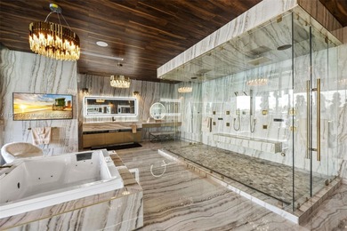 Welcome to 733 Middle River Drive in the gated community of