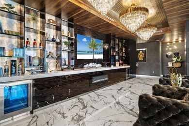 Welcome to 733 Middle River Drive in the gated community of