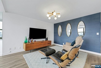 Experience luxury high-rise living at its finest in this