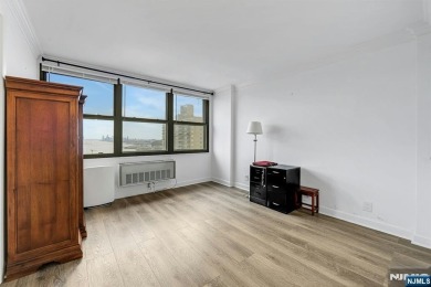 Experience luxury high-rise living at its finest in this