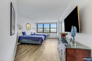 Experience luxury high-rise living at its finest in this