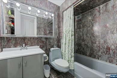 Experience luxury high-rise living at its finest in this