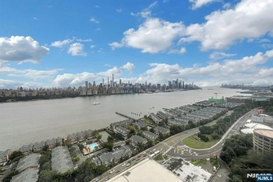 Experience luxury high-rise living at its finest in this