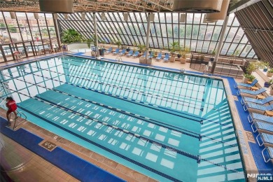 Experience luxury high-rise living at its finest in this