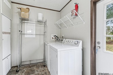 8 yr old Mobile home on .67 acres! Flood zone X. Large covered