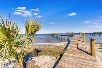 PRICE REDUCED!  Custom Built, BAY FRONT home with private dock