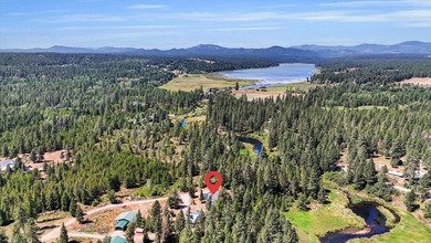 Unicorn alert! A waterfall graces this dynamic, private plot of