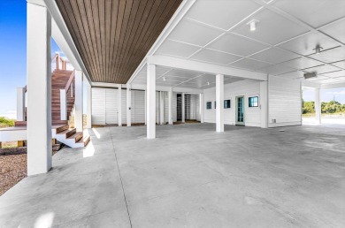 This new construction, six-bedroom, six-bathroom Gulf-front home