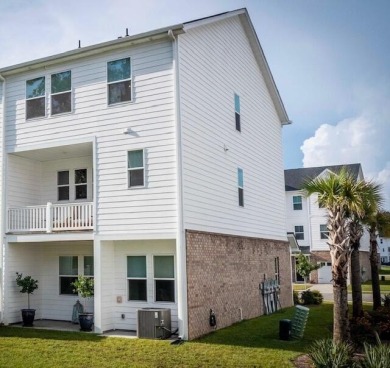 Discover this beautifully appointed three-story townhome