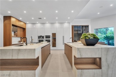 WELCOME TO THIS NEARLY 12,000sqft CUSTOM HOME WITHIN THE GUARD