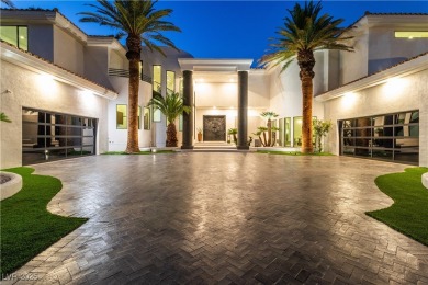 WELCOME TO THIS NEARLY 12,000sqft CUSTOM HOME WITHIN THE GUARD