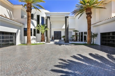 WELCOME TO THIS NEARLY 12,000sqft CUSTOM HOME WITHIN THE GUARD